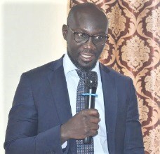 Dr Fred Adomako-Boateng, the Bono East Regional Director of Health, addressing the review meeting